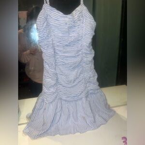 White and blue striped dress flared at the bottom.